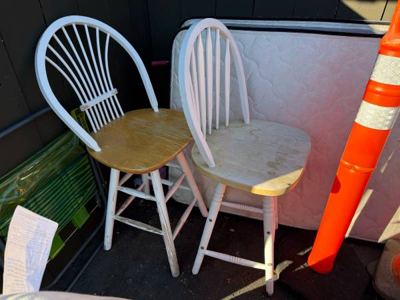 Two matching wooden chairs with white-painted backs and legs. 1